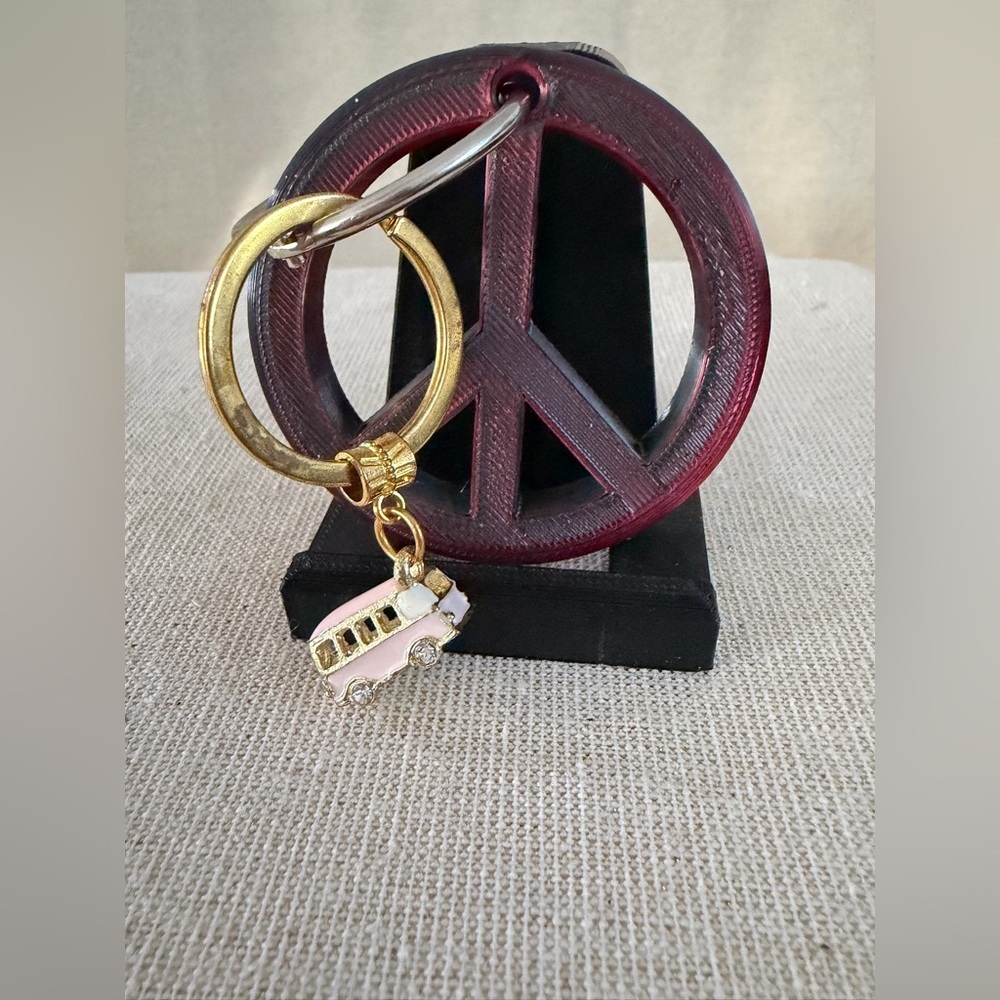 Gold Ring Keychain with Pink Bus Charm also peace sign keychain